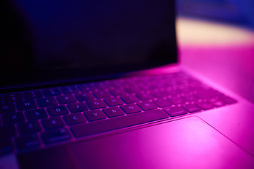 Image showing Laptop, keyboard or technology in basement in dark room at night for hacking, phishing or cybersecurity. Database, code or ransomware for hacking research, digital transformation or networking site