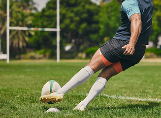 Image showing Rugby, sports man or kickball in game, practice workout or training match on stadium field outdoors. Fitness body, score goals or athlete player action playing in cardio exercise on grass in France