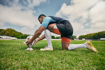 Image showing Rugby kick, sports man or ball in training game, practice workout or match on stadium field outdoors. Fitness, ready or athlete player in action playing in cardio exercise on grass in France, Paris