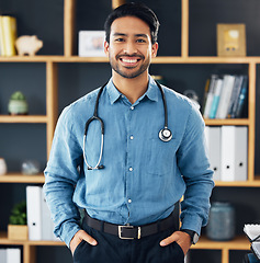 Image showing Happy, medicine and portrait of an Asian doctor for consultation, healthcare and medical help. Smile, hospital and a friendly male clinic worker ready for surgery, gp work and nursing in an office