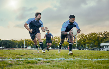 Image showing Rugby, sports and men training, score and exercise for balance, endurance and workout for wellness. Team, male athletes or players with ball, victory or winning on grass field, competition and active