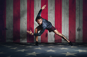 Image showing Portrait, fitness and a sports man with a usa flag in studio on a stars and stripes background for competition. Health, exercise or patriot with a male athlete representing the red, white and blue