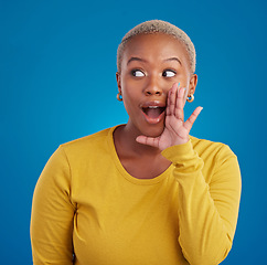 Image showing Black woman, gossip and wow secret in studio with hand on face for sale announcement. African female model on a blue background to whisper message, news information or rumor about discount mockup