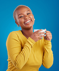 Image showing Black woman, happy and coffee or tea portrait in studio with a smile and happiness. African female model with a drink and hands on cup to relax with a positive mindset on blue background with beauty