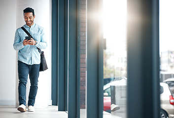 Image showing Professional man with phone, communication with typing or scroll through social media with smile. Happy young male, reading text and contact with network, technology and creative employee at startup