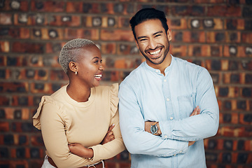 Image showing Young, professional team and partnership, laughing with teamwork and arms crossed on wall background. Happy working together, creative pair and diversity, black woman and man, collaboration and trust