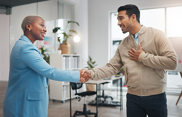 Image showing Business people, handshake and partnership in collaboration for trust, unity or teamwork at the office. Businessman and woman shaking hands in meeting, b2b or agreement for greeting, welcome or deal