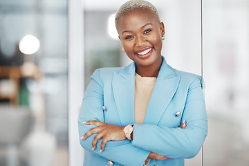 Image showing Black woman, portrait smile and arms crossed in small business management leaning on glass in modern office. Happy African American female smiling in confidence for corporate success at the workplace