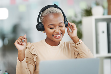 Image showing Dance, happy and black woman with music during work, radio break and listening to audio. Smile, stress relief and dancing African employee with headphones for streaming a podcast, songs and playlist