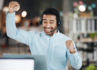 Image showing Asian man, call center and celebration for winning, sale or discount on laptop in telemarketing at office. Happy and excited male consultant agent in joy for win, victory or achievement on computer