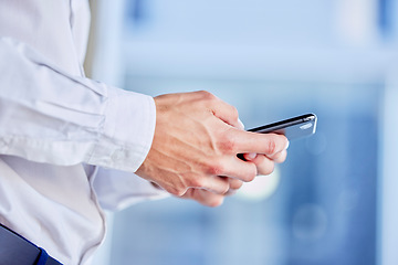 Image showing Hands, phone and texting with a business man in his office, closeup for communication or networking. Mobile, contact and internet with a male employee typing a text message or making a call