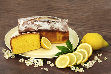 Image showing Homemade Lemon Drizzle Cake with Spring Blossom Flowers