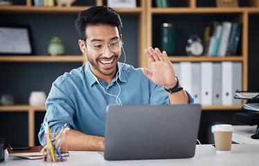 Image showing Happy asian man, laptop and smile for video call or communication with earphones at office desk. Male creative designer smiling and waving for webinar, meeting or networking on computer at workplace