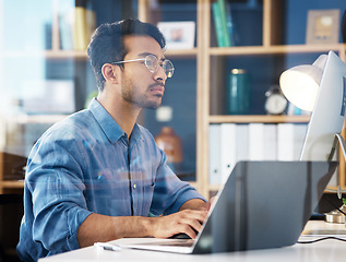 Image showing Serious, business man typing on laptop, computer and software development, online research or information technology. App developer or asian person on digital multimedia and office glass reflection