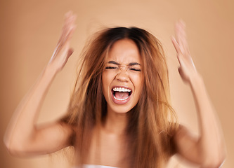 Image showing Anger, screaming and woman with hair loss in studio isolated on a brown background. Haircare, damage and upset female model shouting after salon treatment fail, split ends or messy hairstyle problem