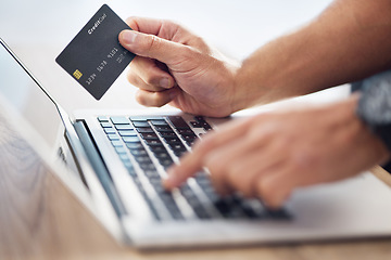 Image showing Hands, laptop and credit card for ecommerce, online shopping or electronic purchase on wooden desk. Hand of shopper working on computer for internet banking, app or wireless transaction on table