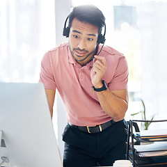 Image showing Serious asian man, call center and computer in customer service or desktop support at office desk. Male consultant agent standing by PC in telemarketing advice or insurance with headset at workplace