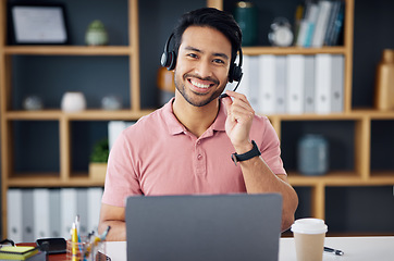 Image showing Asian man, call center and portrait smile on laptop for consulting, customer service or support at office desk. Happy male consultant with headphones by computer for telemarketing or online advice