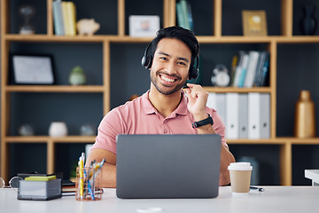 Image showing Happy asian man, call center and smile on laptop for consulting, customer service or support at office desk. Portrait of male consultant with headphones by computer for telemarketing or online advice