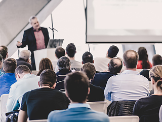 Image showing Male speeker having talk at public event.