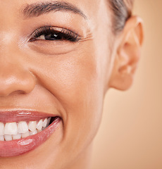 Image showing Happy, portrait and closeup of woman in studio for makeup, cosmetic and skincare on brown background. Smile, face and zoom on girl excited for beauty, treatment or dermatology, smiling and isolated