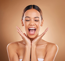 Image showing Beauty, excited and a woman with hands on face for skin care glow and shine in studio on brown background. Aesthetic female model with eyes closed for spa facial, dermatology cosmetic and wellness