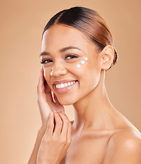 Image showing Face portrait, skincare and woman with cream in studio isolated on a brown background. Dermatology, beauty cosmetics and happy female model with lotion, creme or facial moisturizer of skin health.