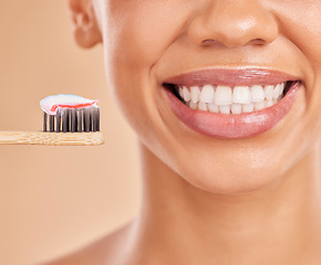 Image showing Toothpaste, bamboo toothbrush and smile of woman in studio isolated on a brown background. Sustainable, eco friendly and face of happy female with wood brush for brushing teeth and dental health.