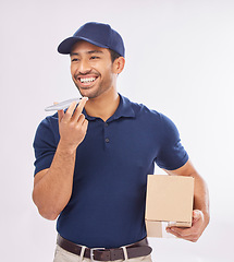 Image showing Courier, delivery and Asian man with box, phone call and success against studio background. Male employee, employee and worker with package, parcel and smartphone for conversation, shipping and smile