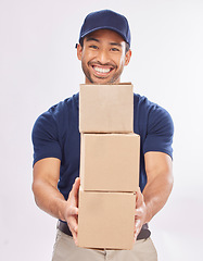 Image showing Delivery man, shipping boxes and portrait of a employee in studio with courier service and a smile. Box, supply chain and happiness of a worker with distribution, online shopping and mail services