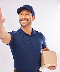Image showing Delivery man, shipping box and smile of a employee in studio with courier service. Happy, retail supply chain and store export of a worker with distribution, online shopping and mail services