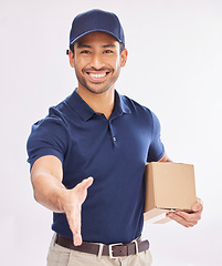 Image showing Box, portrait smile and delivery man with handshake in studio isolated on a white background. Welcome, greeting or happy Asian male courier with package shaking hands for hello, logistics deal or crm