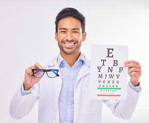 Image showing Portrait of doctor holding glasses, eye test and smile at vision clinic, reading assessment and eyesight in India. Healthcare, wellness and happy man optometrist with medical exam for eyes and sight.