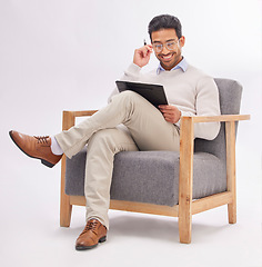 Image showing Chair, clipboard and therapist man isolated on a white background reading therapy notes, checklist and review. Asian professional person or psychologist relax on armchair with career folder in studio