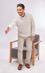 Image showing Handshake offer of business man isolated on a white background for welcome meeting or psychologist client hello. Asian person or therapist shake hands for deal or introduction with armchair in studio