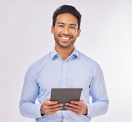 Image showing Portrait, smile and business man with tablet in studio isolated on a white background. Ceo face, professional boss and happy Asian male entrepreneur from Singapore from with touchscreen technology.