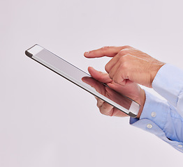 Image showing Hands, tablet and business man typing in studio isolated on a white background. Technology, social media and male professional with touch screen for research, web scrolling and internet browsing.