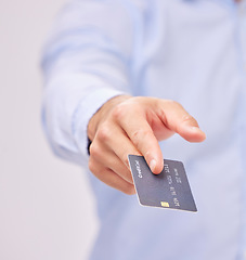 Image showing Credit card in hand, payment and shopping with man, purchase product or service isolated on white background. Closeup, commerce and customer, buying with promotion and sale, shop and male in studio