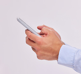 Image showing Hands, technology and typing with phone in studio isolated on a white background. Cellphone, networking and male or man with mobile smartphone for texting, social media or internet browsing online