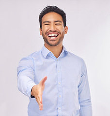 Image showing Portrait, laughing and business man with handshake in studio isolated on white background. Intro, funny or happy Asian professional shaking hands for deal, partnership or welcome, agreement or hiring