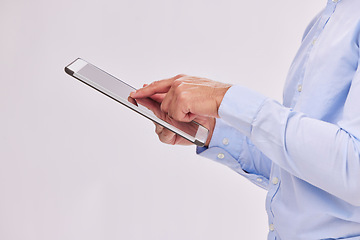 Image showing Hands, tablet and business man typing in studio isolated on a white background. Technology, social media and male professional with touch screen for research, web scrolling and internet browsing.