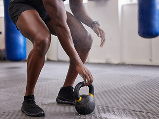Image showing Kettlebell, hands and legs of man training for weightlifting, fitness workout and sports challenge in gym. Closeup bodybuilder holding heavy weights for exercise, power and muscle of strong athlete