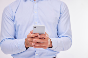 Image showing Hands, business man and typing with phone in studio isolated on a white background. Cellphone, networking and male professional with smartphone for texting, social media or internet browsing online