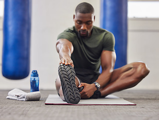 Image showing Black man, stretching legs and fitness in gym for training, performance and bodybuilding. Bodybuilder warm up for strong feet, sports workout and start healthy exercise for mobility, energy and power