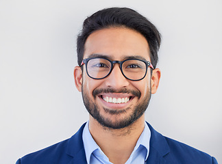 Image showing Happy, portrait and excited businessman in studio, smile and confident against a grey background space. Face, happiness and young mexican entrepreneur posing empowered, professional and handsome