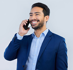 Image showing Smile, smartphone and Indian man in studio, talking and networking on white background. Phone call, conversation and businessman in suit, communication and technology for investor trading at startup.