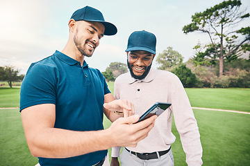 Image showing Golf course, men and friends with talk for using phone, smile and personal trainer with video for training together. Golfer, smartphone and point at meme on social media app with sports for diversity