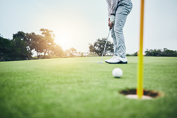 Image showing Sports, golf hole and man with golfing club on course ground for game, practice and training for competition. Professional golfer, grass and male athlete hit ball for winning, score or tee stroke