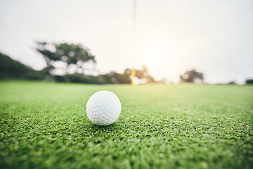 Image showing Sports, golf ball and target on course in club for competition match, tournament and training. Pitch, challenge and games with equipment on grass field for leisure, recreation hobby and practice