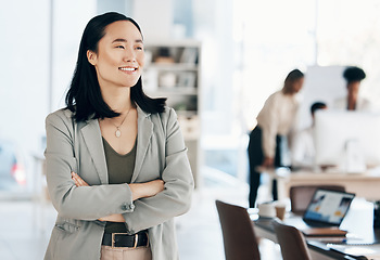 Image showing Asian, business woman with arms crossed and happy, thinking with leadership and professional mindset in workplace. Career, success and corporate female in Japanese office, happiness and confidence